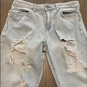 light blue baggy ripped jeans